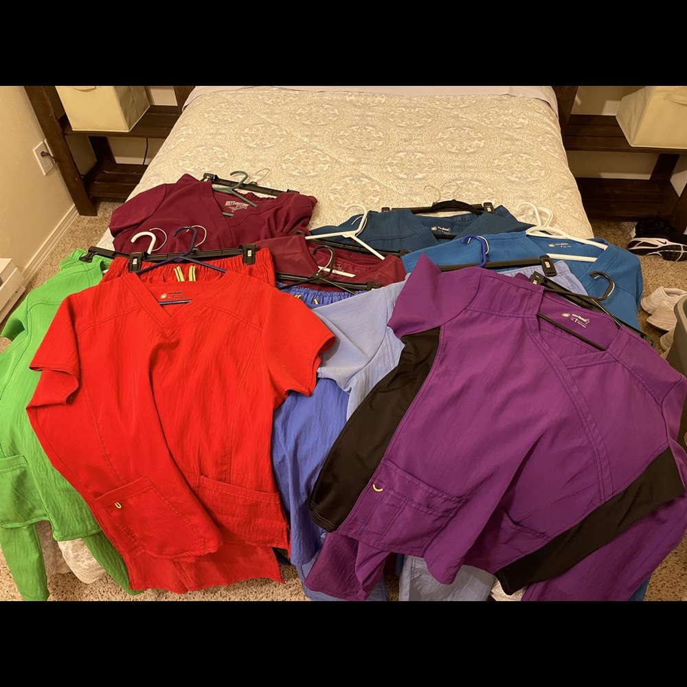 9 sets of WW scrubs. Perfect gently used condition.Selling entire lot.